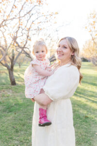 Mother holding baby in Cumming Georgia field