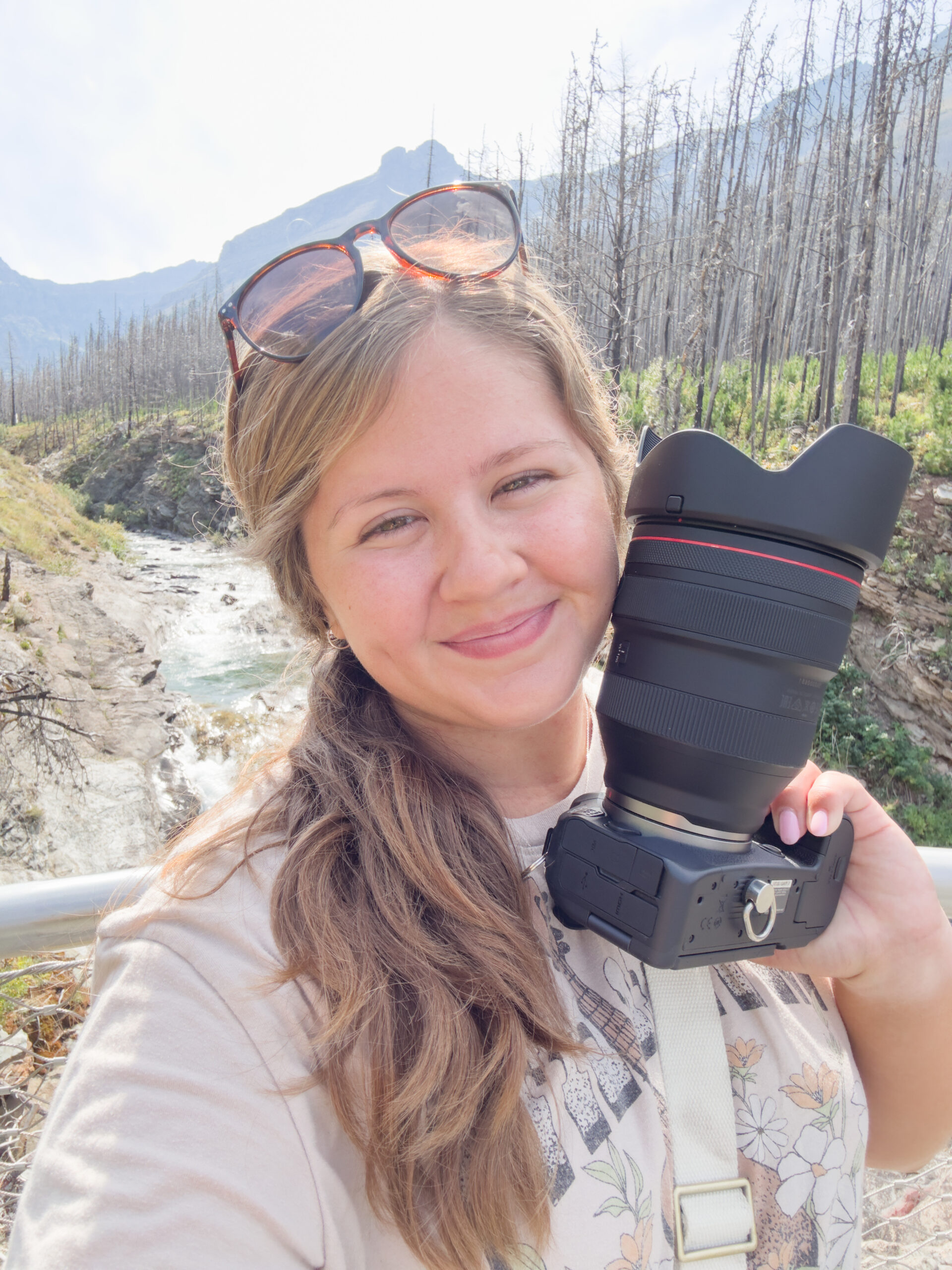Amanda smiling holding her camera in Dallas Texas